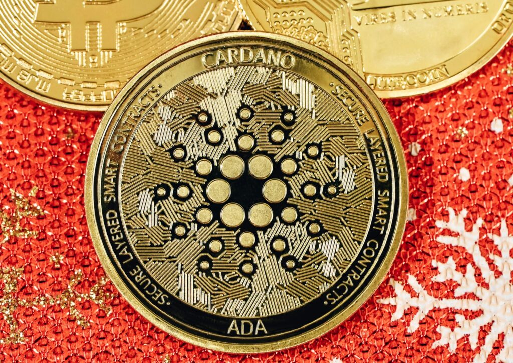 a bitcoin sitting on top of a red and gold background